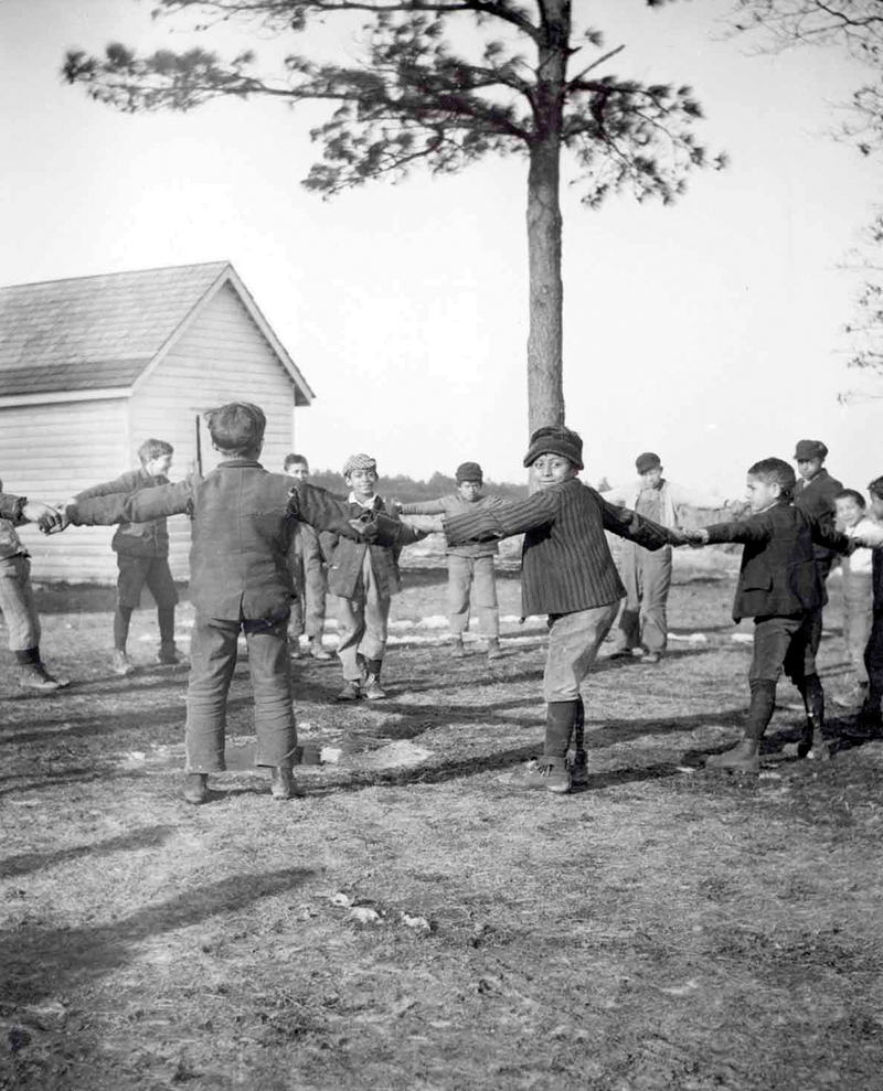 Nanticoke schoolboys playing 'bear in ring', Delaware, ca. 1911. Boy facing the camera is Roosevelt Perkins. Photo by Frank G. Speck. (N01304)